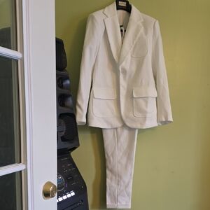 White Women's Two-Piece Blazer and Trouser Suit.